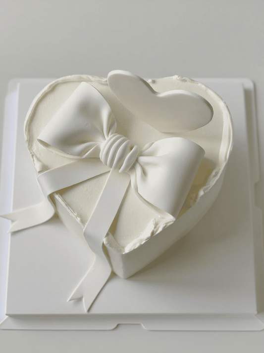 Minimalist White Bow Cake